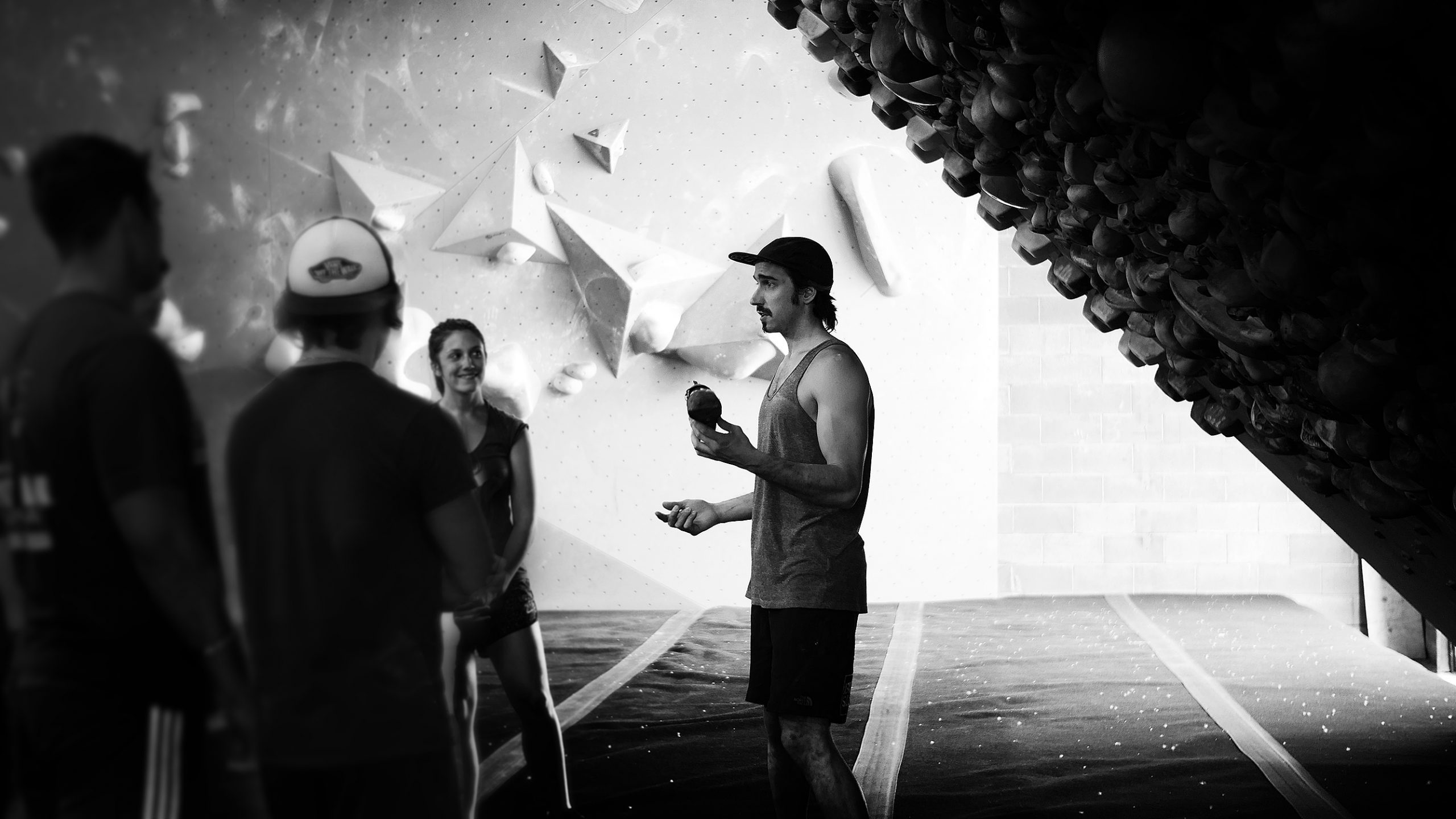 A group of people in a climbing workshop.