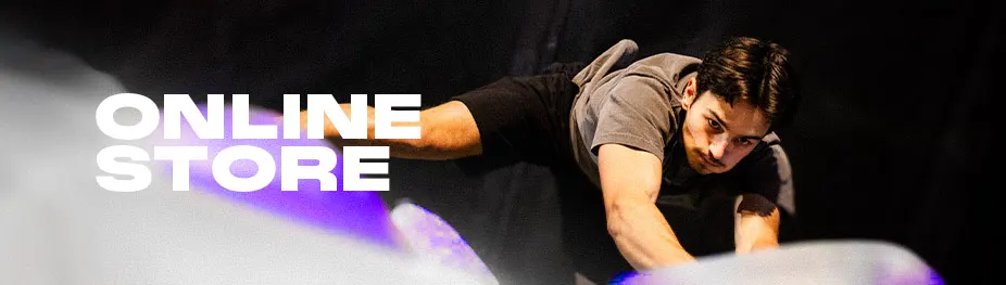 Man bouldering at the Bloc Shop, seen from above.